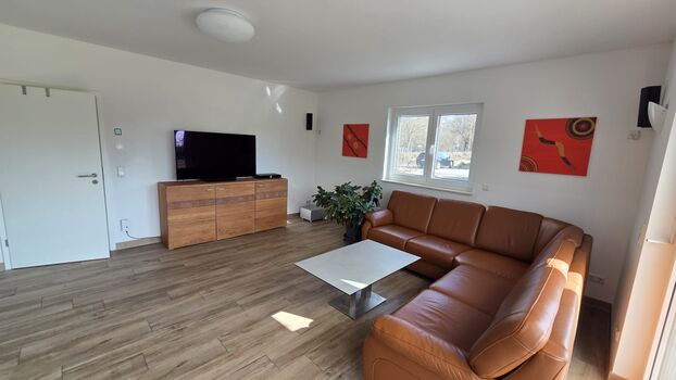 Einfamilienhaus bis 10 Personen - Wohnzimmer mit zwei Einzelbetten Einfamilienhaus bis 10 Personen - Wohnzimmer mit zwei Einzelbetten