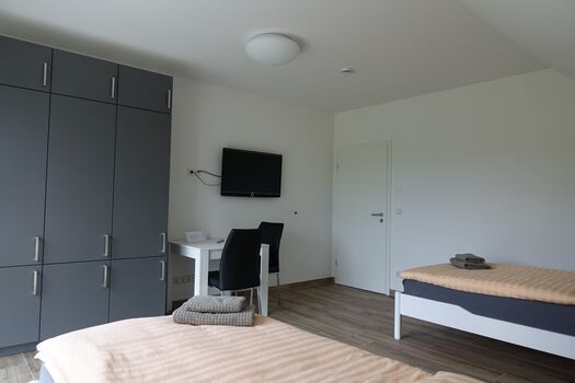 Einfamilienhaus bis 10 Personen - Schlafzimmer 1 mit zwei Einzelbetten Einfamilienhaus bis 10 Personen - Schlafzimmer 1 mit zwei Einzelbetten