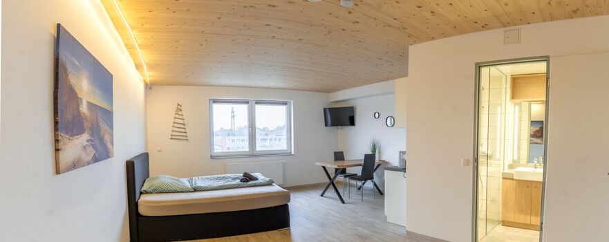 Monteurzimmer Lübeck – helles Apartment mit Bett, Essplatz und TV Monteurzimmer Lübeck – helles Apartment mit Bett, Essplatz und TV