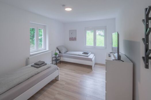 Modernes Schlafzimmer mit Einzelbetten Modernes Schlafzimmer mit Einzelbetten