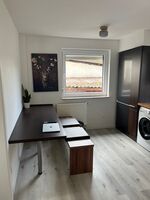 Küche/ Sitzmöglichkeit - Apartment mit Terrasse Küche/ Sitzmöglichkeit - Apartment mit Terrasse
