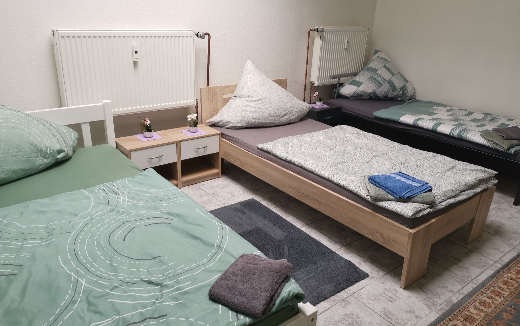 Drei Bett Zimmer