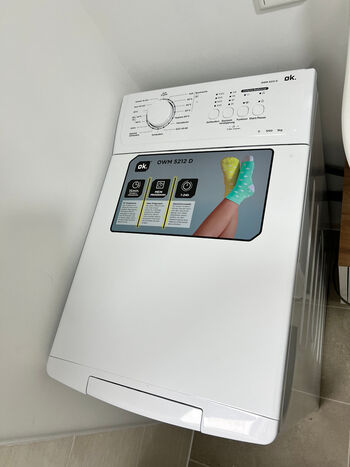 Mit Waschmaschine im Bad