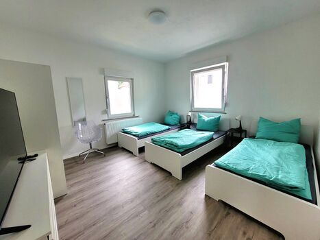 Schlafzimmer (2 oder 3 Einzelbetten)