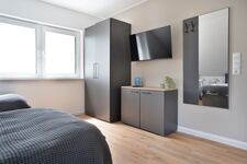 Modern eingerichtete Studios mit voll ausgestatteter Küche Bild 3