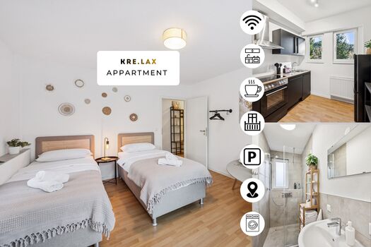 Wohnzimmer mit zwei hochwertigen Boxspringbetten und einem gemütlichen Essbereich. Die Betten können wahlweise einzeln oder als komfortables Doppelbett gestellt werden.