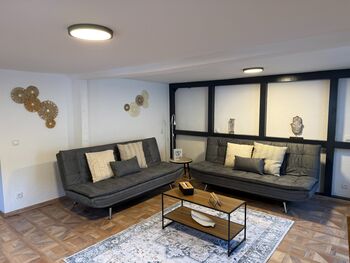 Wohnzimmer mit 2 Schlafsofas
