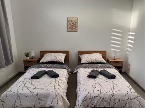 Schlafzimmer mit 2 Einzelbetten - Apartment 1
