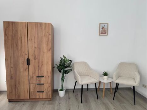 Schlafzimmer mit 2 Einzelbetten und Sitzmöglichkeiten - Apartment 1